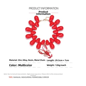 Detailed view of red resin bead necklace with large lobster pendant and size specs