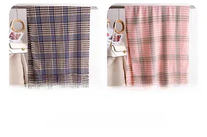 Detail view of houndstooth scarf showing navy, brown, and pink weave textures