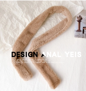 Detail of soft camel faux cashmere scarf with plush texture on minimalist white background
