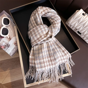Classic houndstooth wool-like scarf with fringe edges in warm brown and beige tones