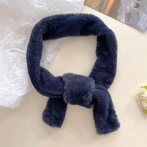 Detail of navy blue faux cashmere scarf with a loop-through knot design and soft texture