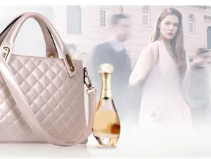 Detail of nude pink quilted shoulder bag with gold hardware and adjustable strap