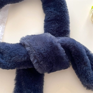 Detail of navy blue faux fur scarf featuring soft plush texture and knot fastening