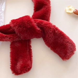 Detail of red faux fur scarf texture showing thick soft plush fiber and warm winter finish