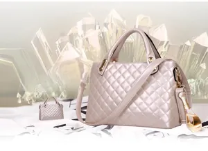 Macro detail of quilted champagne gold handbag with crystal stone background