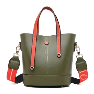 Olive green bucket bag with lychee texture and contrasting orange fabric strap