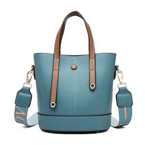 Stylish dark blue bucket bag with brown handle and orange LOVE text shoulder strap