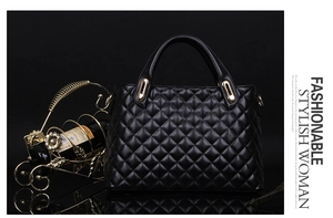 Detail of black quilted shoulder bag with gold hardware accents on a luxury backdrop