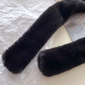 Close-up of thick black faux fur texture on a warm winter neck scarf for men and women