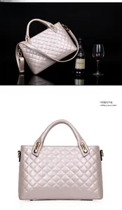Quilted champagne gold handbag with glossy finish and detachable metal chain strap