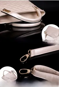 Close-up of champagne gold hardware and quilted leather texture on luxury handbag