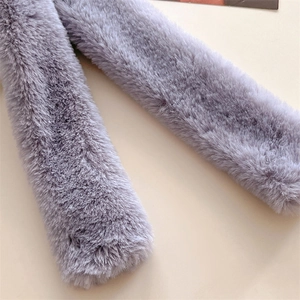 Detailed close-up of soft light purple faux fur scarf with fluffy plush texture