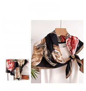 Detailed pattern of floral silk square scarf with golden and dark red rose print