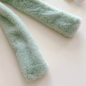 Close-up of soft faux fur neck warmer scarf with premium plush texture and pale green finish