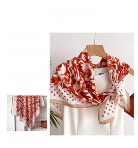 Detailed pattern of orange camellia flower silk scarf with polka dots and golden border
