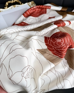 Detailed view of large floral print on 90cm silk-like scarf with twill texture