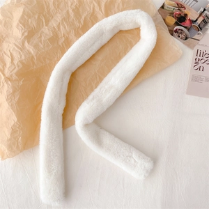 Detail of soft white faux fur scarf texture showing thick and fluffy plush material