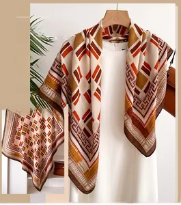 Detail of elegant geometric pattern silk scarf with earth tones and herringbone texture