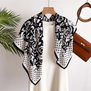 Silk-like black and white scarf featuring large camellia flowers and classic polka dot prints