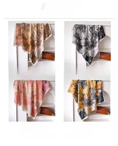 Four color options of botanical print silk scarves including brown black pink and yellow