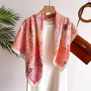 Floral silk shawl with tropical jungle prints on pink dress with brown handbag background