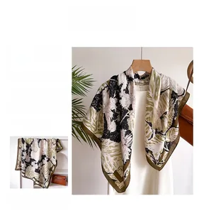 Detail of vintage plant and squirrel print on elegant square silk-like satin scarf