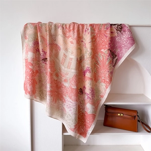 Close-up of silk scarf with tropical jungle prints and elegant draped textures