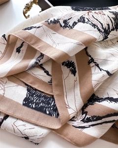 Detailed view of silk square scarf featuring vintage squirrel and forest nature sketches