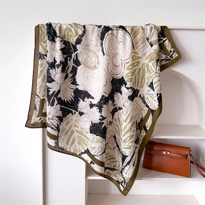 Close-up of squirrel and plant print silk scarf draped over a white arched shelf