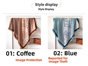 Detail of silk-feel scarves with geometric patterns in coffee and blue tones