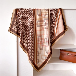 Brown monogram silk scarf with geometric letters and herringbone pattern for women