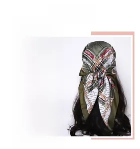 Close-up of silk-feel scarf featuring vintage plaid and chain patterns worn as a headwrap