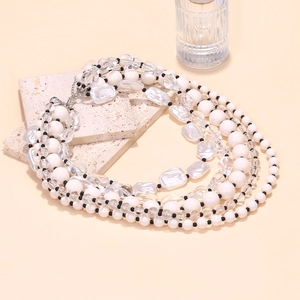 Bohemian multi-layer beaded necklace with white and transparent beads on stone