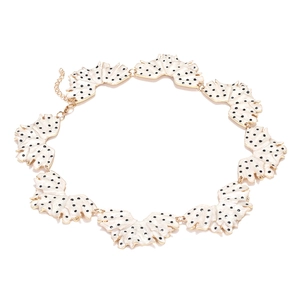 Handmade enamel leaf necklace with bold black polka dots on white shell-shaped petals