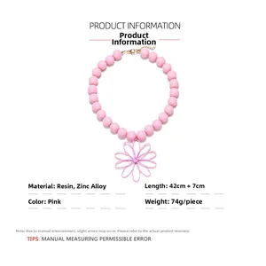 Detailed view of pink resin beaded necklace with flower pendant and 42+7cm adjustable chain