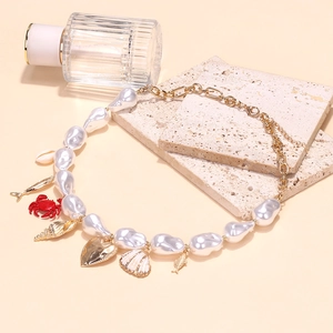 Baroque pearl necklace with gold crab heart shell charms and adjustable lobster clasp