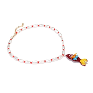 Handmade beaded necklace with irregular white pearls and vibrant tropical fish pendant