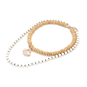 Bohemian layered necklace with wooden beads, faux pearls and spiral conch shell pendant