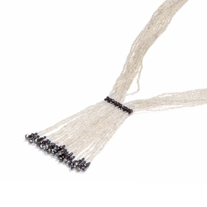 Exaggerated silver multi-strand seed bead fringe necklace with tiered tassels and grey accents