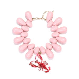 Pink teardrop beaded necklace featuring a detailed red crayfish pendant on white background