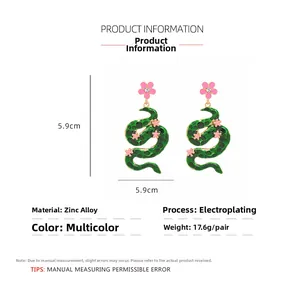 Detailed view of snake earrings with dimensions 5.9cm x 5.9cm and zinc alloy specs
