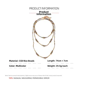 Detail view of multi-layer beaded necklace featuring metallic beads and lobster clasp closure