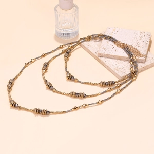 Bohemian multi-layer layered beaded necklace in gold and metallic grey tones