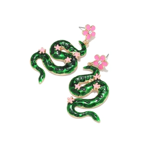 Detail of green enamel snake earrings with pink flowers and crystal inlay decoration