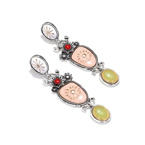 Detail of vintage enamel floral drop earrings with layered resin stones and silver finish
