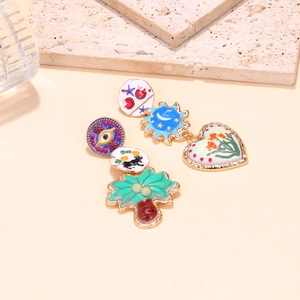 Colorful enamel asymmetric earrings with evil eye, palm tree, and heart charms in gold plating