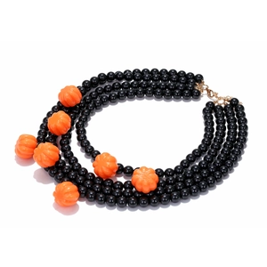 Detail of triple-layer Halloween necklace featuring black beads and pumpkin charms