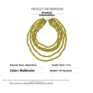 Macro detail of multilayer olive green resin bead necklace with gold clasp and extension chain