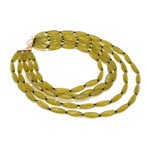 Detail of four-layer bohemian necklace with olive green beads and gold lobster clasp