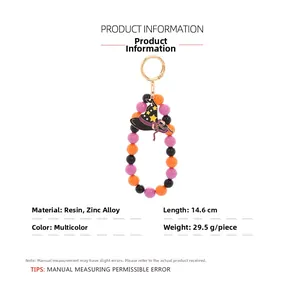 Detailed view of Halloween beaded wristlet with wizard hat charm and size dimensions